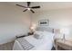 Comfortable bedroom with a cushioned headboard and a ceiling fan, offering both comfort and style for a restful retreat at 3907 San Pietro Ct, Punta Gorda, FL 33950