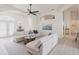 Bright living room with an open layout, stylish decor, and seamless flow to adjacent rooms at 3907 San Pietro Ct, Punta Gorda, FL 33950