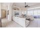 Bright, open-concept living room featuring neutral colors, modern furnishings, and lots of natural light at 3907 San Pietro Ct, Punta Gorda, FL 33950