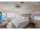 Inviting main bedroom with a large bed, soft lighting, and windows that offer serene views, perfect for relaxation at 3907 San Pietro Ct, Punta Gorda, FL 33950
