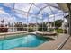 Relaxing spa and pool with screened-in lanai offers stunning waterfront views at 3907 San Pietro Ct, Punta Gorda, FL 33950