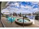 Beautiful pool and spa featuring screened enclosure overlooking the water at 3907 San Pietro Ct, Punta Gorda, FL 33950