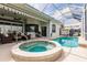 Beautiful outdoor pool and spa area with screened enclosure, perfect for relaxation and entertaining at 3907 San Pietro Ct, Punta Gorda, FL 33950
