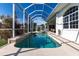 Inviting screened-in pool with clear water and a relaxing hot tub, perfect for enjoying the outdoors at 3907 San Pietro Ct, Punta Gorda, FL 33950