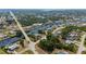 Aerial view of a waterfront lot with mature trees along a canal community at 4009 Yucatan Cir, Port Charlotte, FL 33948