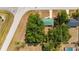 Aerial view of a home with mature trees and landscaped yard at 4009 Yucatan Cir, Port Charlotte, FL 33948