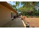 Charming backyard with a patio and lush landscaping, perfect for enjoying the outdoors at 4009 Yucatan Cir, Port Charlotte, FL 33948