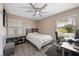 This home features a cozy bedroom with a ceiling fan, and a bright, airy feel at 4009 Yucatan Cir, Port Charlotte, FL 33948