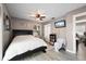 This primary bedroom features stylish decor, a ceiling fan, and a television for relaxing comfort at 4009 Yucatan Cir, Port Charlotte, FL 33948