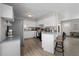 Updated kitchen with stainless steel appliances, breakfast bar, and easy flow to living areas at 4009 Yucatan Cir, Port Charlotte, FL 33948