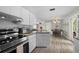 Well-equipped kitchen overlooking the dining area and living spaces with stainless appliances at 4009 Yucatan Cir, Port Charlotte, FL 33948