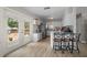 Bright kitchen featuring modern appliances, wood floors, and seamless outdoor access at 4009 Yucatan Cir, Port Charlotte, FL 33948