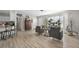 Inviting living room with light wood floors, comfortable seating, and abundant natural light at 4009 Yucatan Cir, Port Charlotte, FL 33948