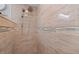 A large shower with modern tile and fixtures offers a spa-like experience in this bathroom at 4009 Yucatan Cir, Port Charlotte, FL 33948
