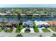 Panoramic aerial view of waterfront homes with manicured lawns, pools, and canal access, offering stunning views at 5010 La Costa Island Ct, Punta Gorda, FL 33950