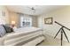 Bedroom with neutral tones, large window, and white furniture at 5010 La Costa Island Ct, Punta Gorda, FL 33950