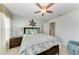 Bedroom featuring a decorative ceiling fan, coastal decor, and a cozy bed at 5010 La Costa Island Ct, Punta Gorda, FL 33950