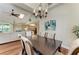 Open dining area offering views to the living room, kitchen, and access to the outdoor space at 5010 La Costa Island Ct, Punta Gorda, FL 33950