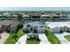 Beautiful waterfront home with lush landscaping, circular driveway, and canal access at 5010 La Costa Island Ct, Punta Gorda, FL 33950