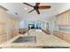 Large kitchen island featuring granite countertops, a stainless steel sink, and barstool seating at 5010 La Costa Island Ct, Punta Gorda, FL 33950