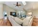 Bright living room featuring high ceilings, a comfortable couch, and a view of the lanai at 5010 La Costa Island Ct, Punta Gorda, FL 33950