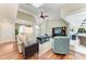 Cozy living room with hardwood floors, neutral walls, and a serene view of the outdoor patio at 5010 La Costa Island Ct, Punta Gorda, FL 33950
