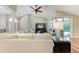Bright living room with high vaulted ceilings, hardwood floors, and sliding glass doors to the outdoor patio at 5010 La Costa Island Ct, Punta Gorda, FL 33950