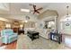 Spacious living room featuring vaulted ceilings, skylight, and an open concept design to the kitchen and dining areas at 5010 La Costa Island Ct, Punta Gorda, FL 33950