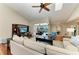 Inviting living room boasting hardwood floors, and sliding glass doors opening to an outdoor pool area at 5010 La Costa Island Ct, Punta Gorda, FL 33950