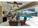 Outdoor living space with screened-in pool, jacuzzi, and seating at 5010 La Costa Island Ct, Punta Gorda, FL 33950