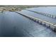 An aerial view showcases the property's proximity to bridges and surrounding waterfront community at 5301 Linksman Pl, North Port, FL 34287