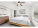Bright bedroom with natural light, large window, and a spacious closet at 5301 Linksman Pl, North Port, FL 34287