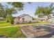 A lovely home with an expansive lawn and large shade trees plus nearby parking at 5301 Linksman Pl, North Port, FL 34287
