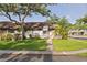 Charming single-story home boasts a well-manicured front lawn, mature trees, and inviting curb appeal at 5301 Linksman Pl, North Port, FL 34287