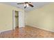Bedroom with sliding closet and tile floor at 5527 Fairway S Dr, Punta Gorda, FL 33982
