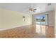Bright living room featuring ceramic tile flooring and sliding glass doors with a view of the pool at 5527 Fairway S Dr, Punta Gorda, FL 33982