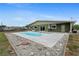 Backyard pool area featuring a clean, well-kept rectangular in-ground pool and concrete patio at 5527 Fairway S Dr, Punta Gorda, FL 33982