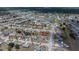 Expansive aerial view of a residential community, showcasing a serene lake and recreational amenities nearby at 6336 Drucker Cir, Port Charlotte, FL 33981