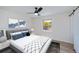 Comfortable bedroom with a ceiling fan, a window, and a plush bed at 6336 Drucker Cir, Port Charlotte, FL 33981