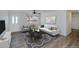 Stylish living room with modern furniture, a patterned rug, and ample natural light at 6336 Drucker Cir, Port Charlotte, FL 33981