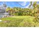 Spacious backyard with privacy landscaping and a shed at 6371 Mckinley Ter, Englewood, FL 34224