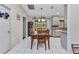 Cozy dining area with a wooden table and tile floors, perfect for Gathering meals at 6371 Mckinley Ter, Englewood, FL 34224