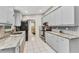 Modern kitchen featuring sleek countertops, stainless steel appliances, and plenty of cabinet space at 6371 Mckinley Ter, Englewood, FL 34224