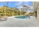 Gorgeous pool and deck area that is perfect for outdoor enjoyment and entertaining at 6371 Mckinley Ter, Englewood, FL 34224