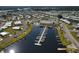 Aerial view of a waterfront community with a marina, pool, clubhouse, and numerous residences at 643 Blackburn Blvd, North Port, FL 34287