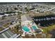 Aerial view of a community showcasing a pool, clubhouse, boat docks, and well-maintained homes at 643 Blackburn Blvd, North Port, FL 34287