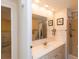 Bright bathroom featuring a shower, vanity, and neutral colors at 643 Blackburn Blvd, North Port, FL 34287
