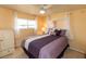 Bedroom featuring a ceiling fan, window views, and neutral colored walls at 643 Blackburn Blvd, North Port, FL 34287