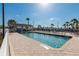 Sparkling community pool with lounge chairs and a cabana, perfect for relaxation and enjoying the Florida sunshine at 643 Blackburn Blvd, North Port, FL 34287