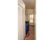 Outdoor utility hallway with tile flooring and access to a back door and outside storage at 643 Blackburn Blvd, North Port, FL 34287
